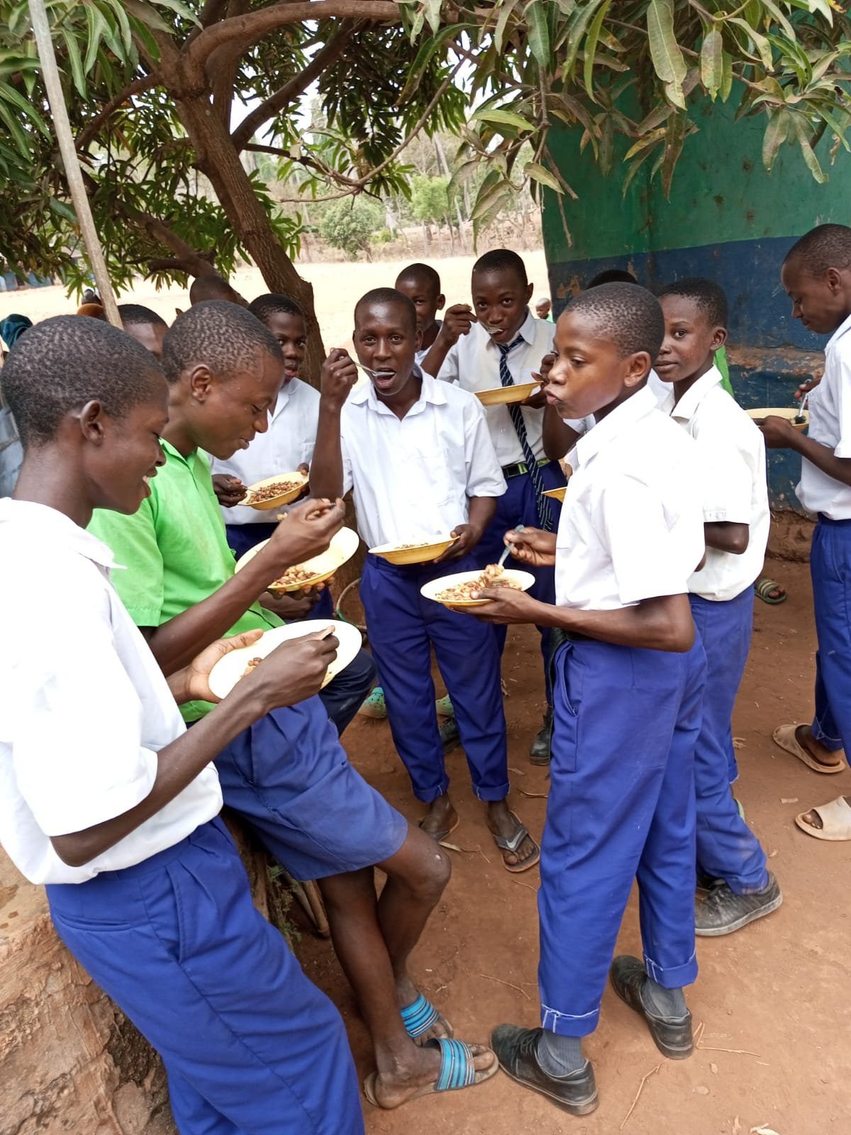 School pupils sharing a meal during a community support visit